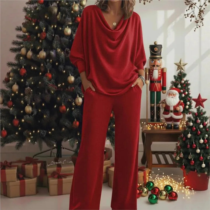 Woman wearing red cowl neck knit top and wide leg pants set