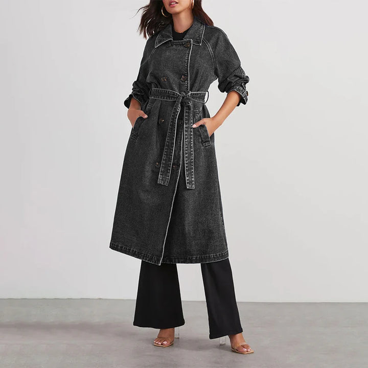 Woman modeling grey denim trench coat with tie belt front view