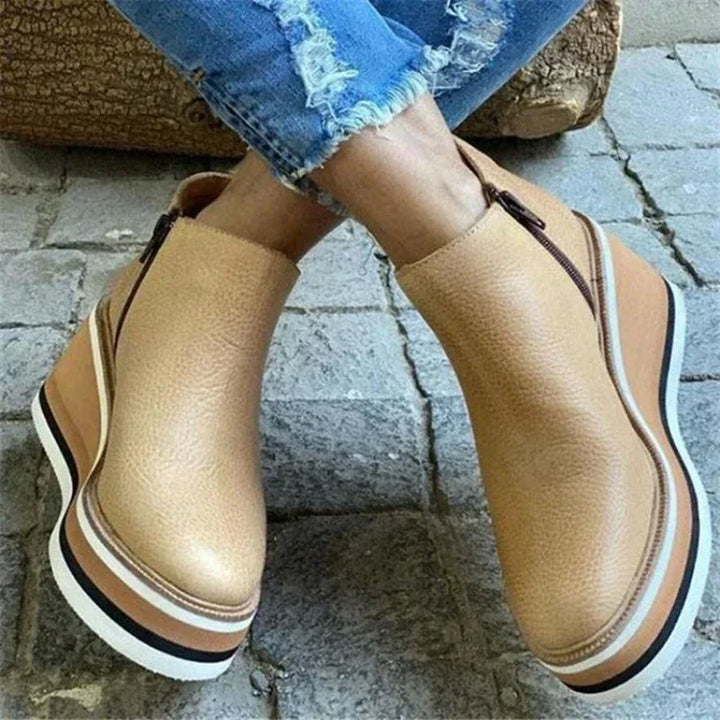 Camel leather platform wedge ankle boots crossed pose