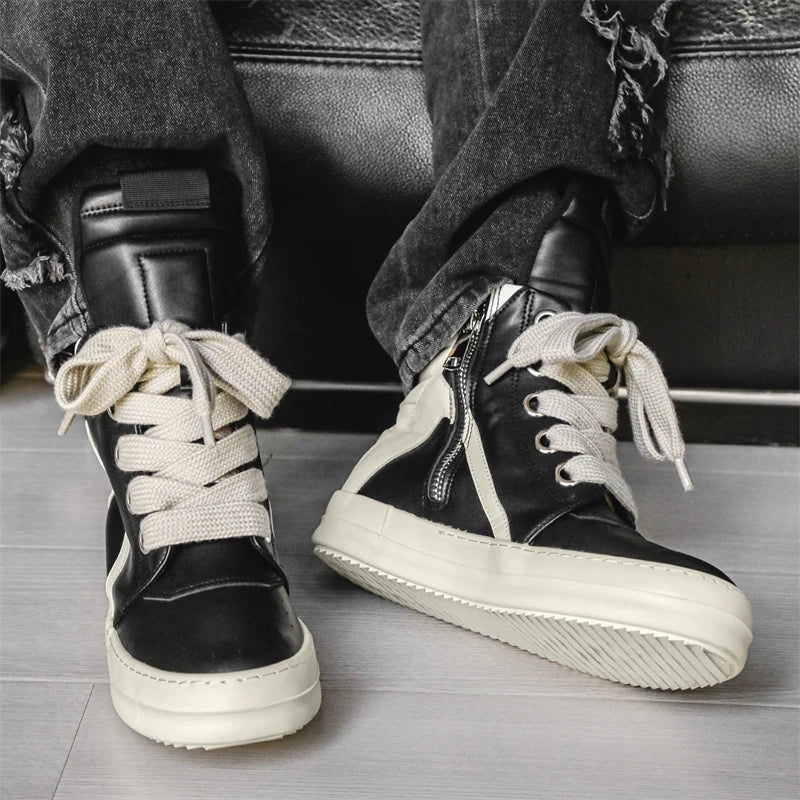 Black high-top sneakers worn front view with laces