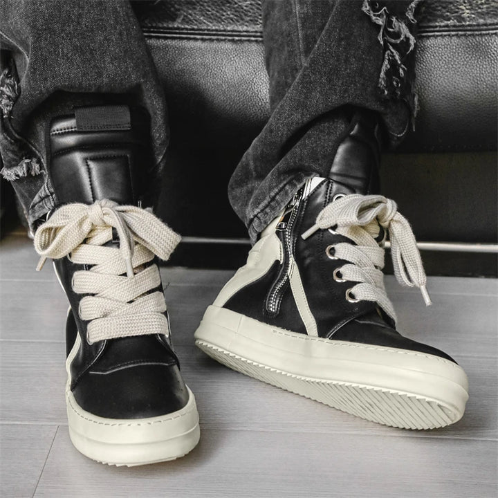 Black high-top sneakers worn front view with laces