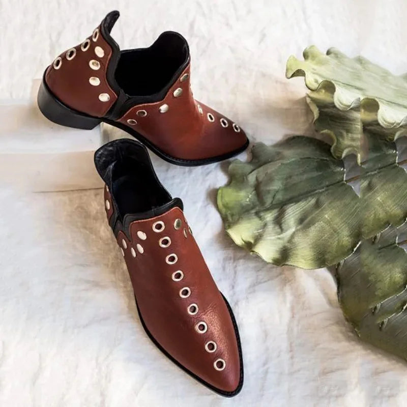 Pair of wine red leather grommet ankle boots with leaf accent