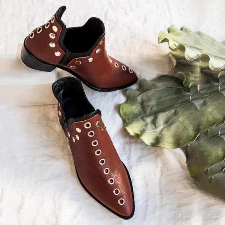 Pair of wine red leather grommet ankle boots with leaf accent