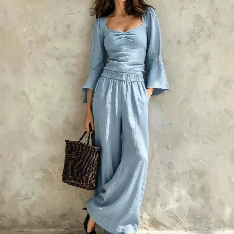 Woman wearing sky blue ruched bodice top and wide leg pants set