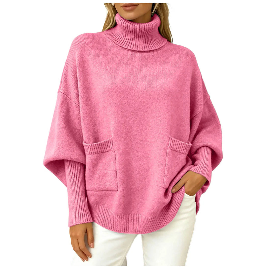 Woman wearing pink oversized turtleneck sweater with front pockets