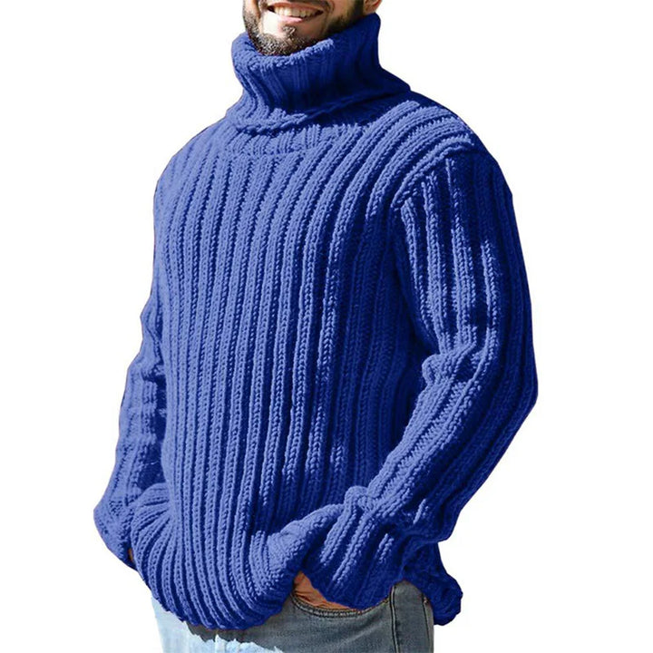 Man wearing blue ribbed turtleneck sweater