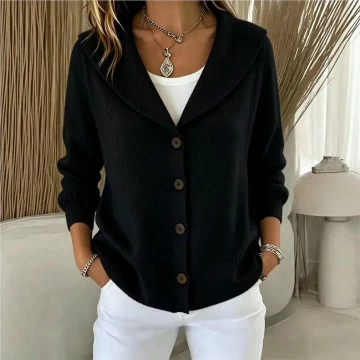 Woman wearing black shawl collar button front cardigan