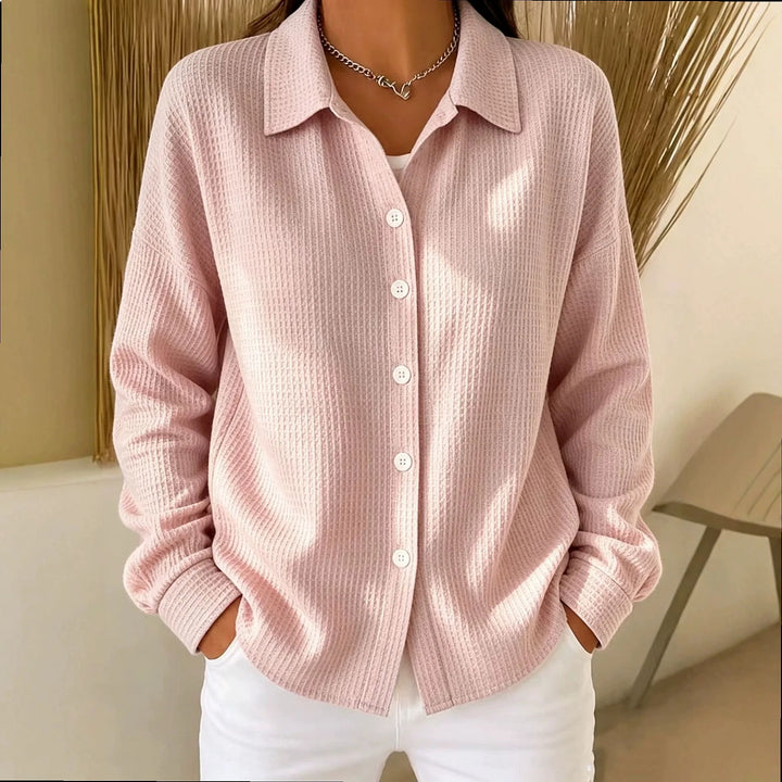 Woman wearing pink waffle knit button-front shirt