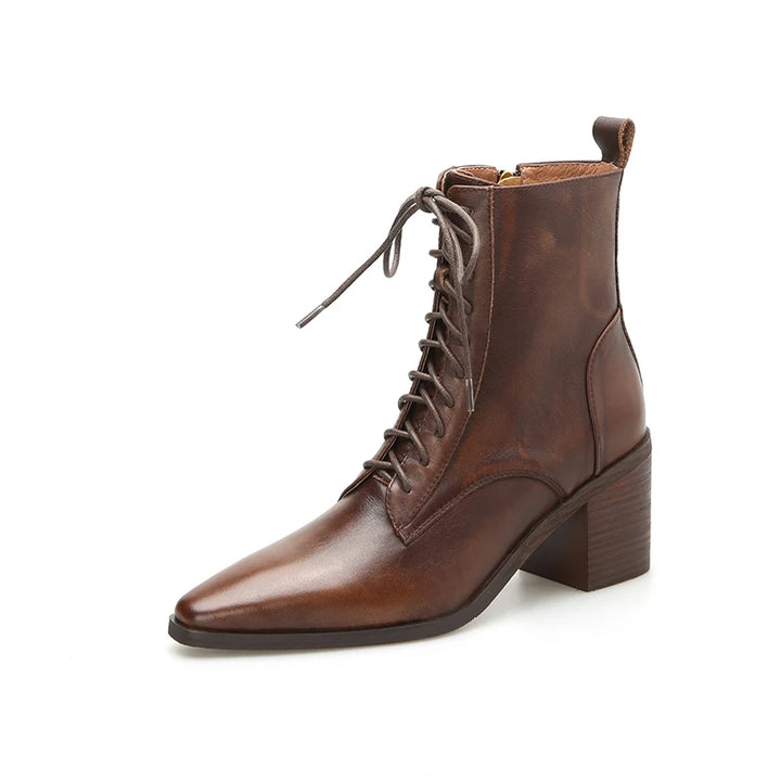 Brown leather ankle boot angled studio shot