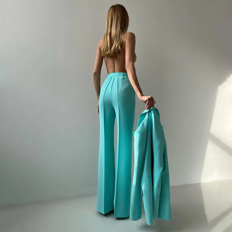 Back view of emerald flared trousers with open back top