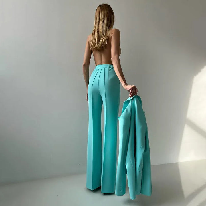 Back view of emerald flared trousers with open back top