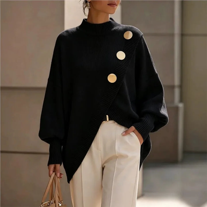 Woman wearing black asymmetric hem sweater with gold buttons