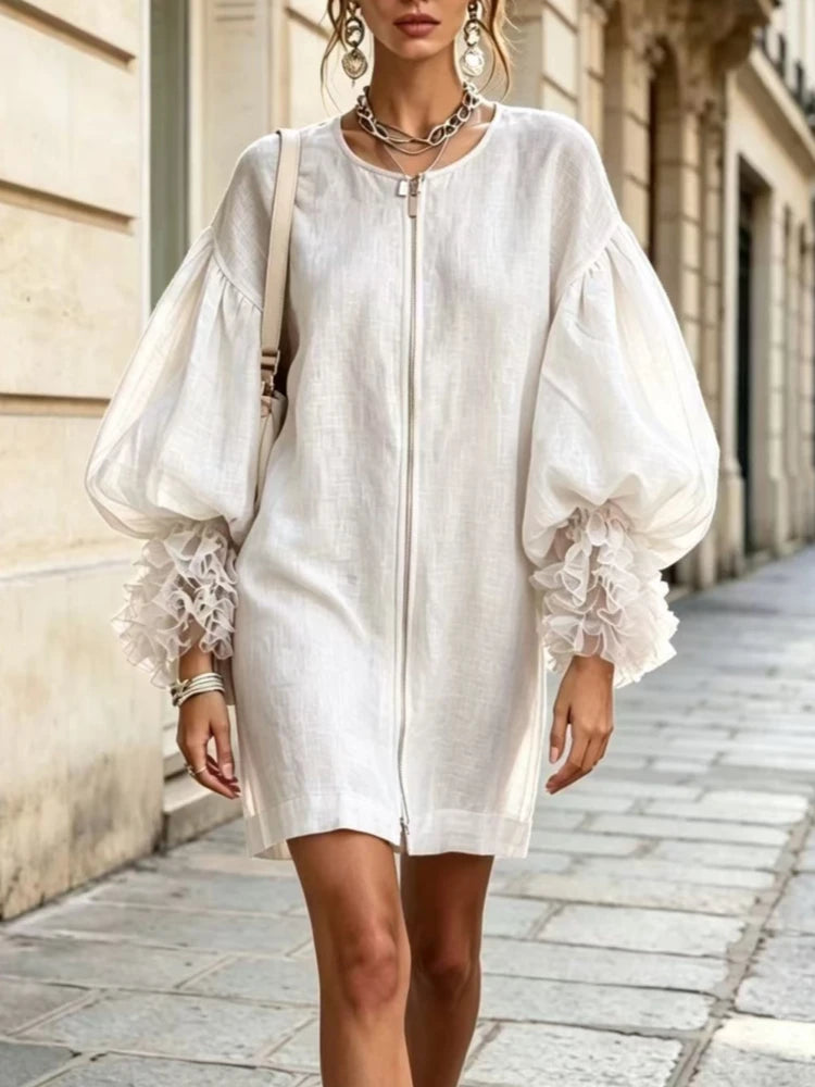 White mini dress with balloon sleeves and ruffle cuffs