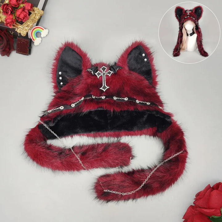 Burgundy faux fur cat ear hat worn on model with fur tails draped down
