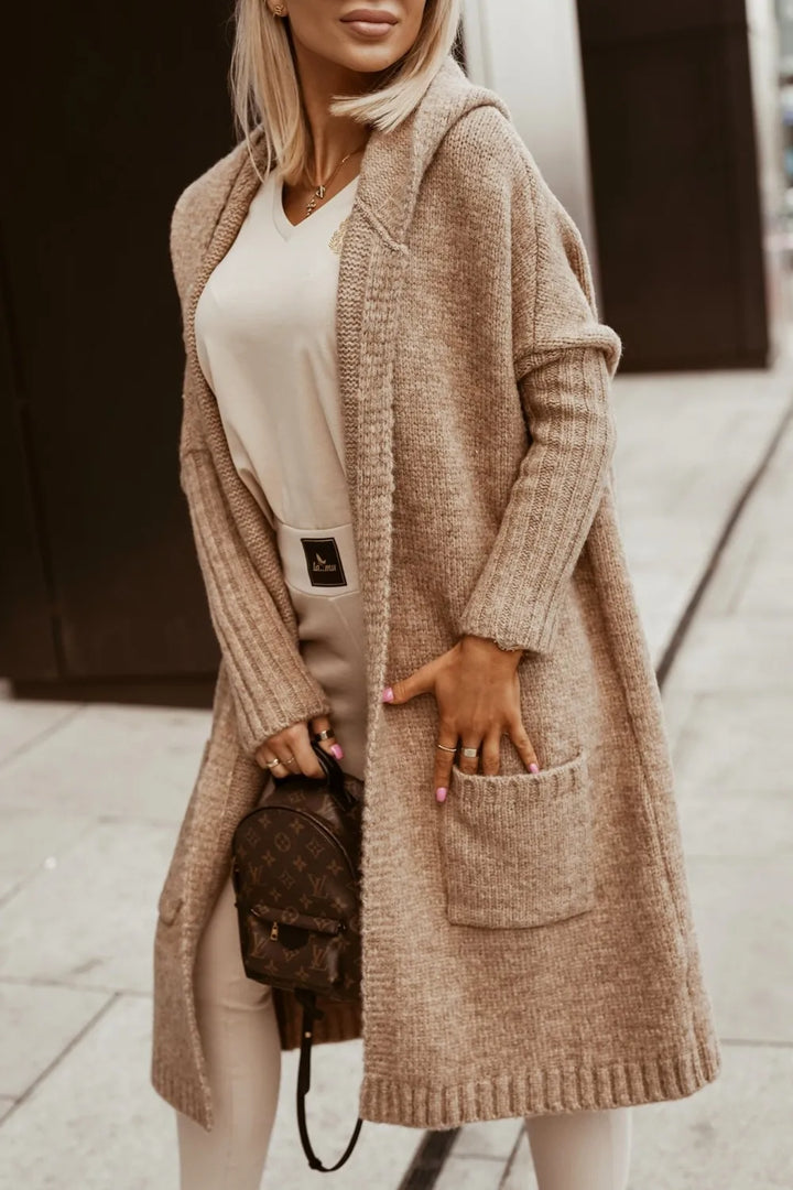Woman wearing camel hooded longline cardigan with hip pockets