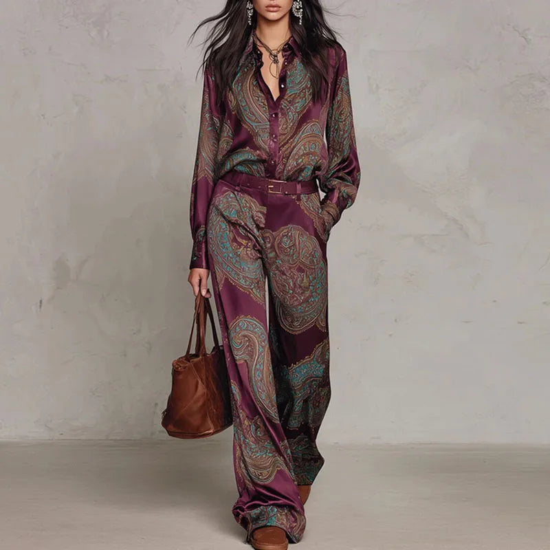 Woman wearing wine red paisley print two-piece shirt and wide leg pants set with belt