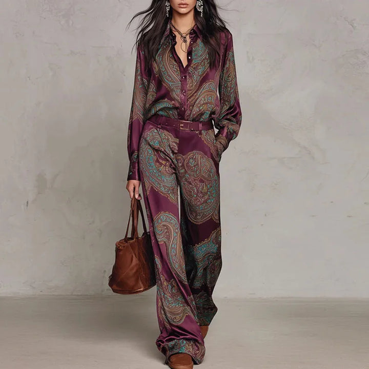 Woman wearing wine red paisley print two-piece shirt and wide leg pants set with belt