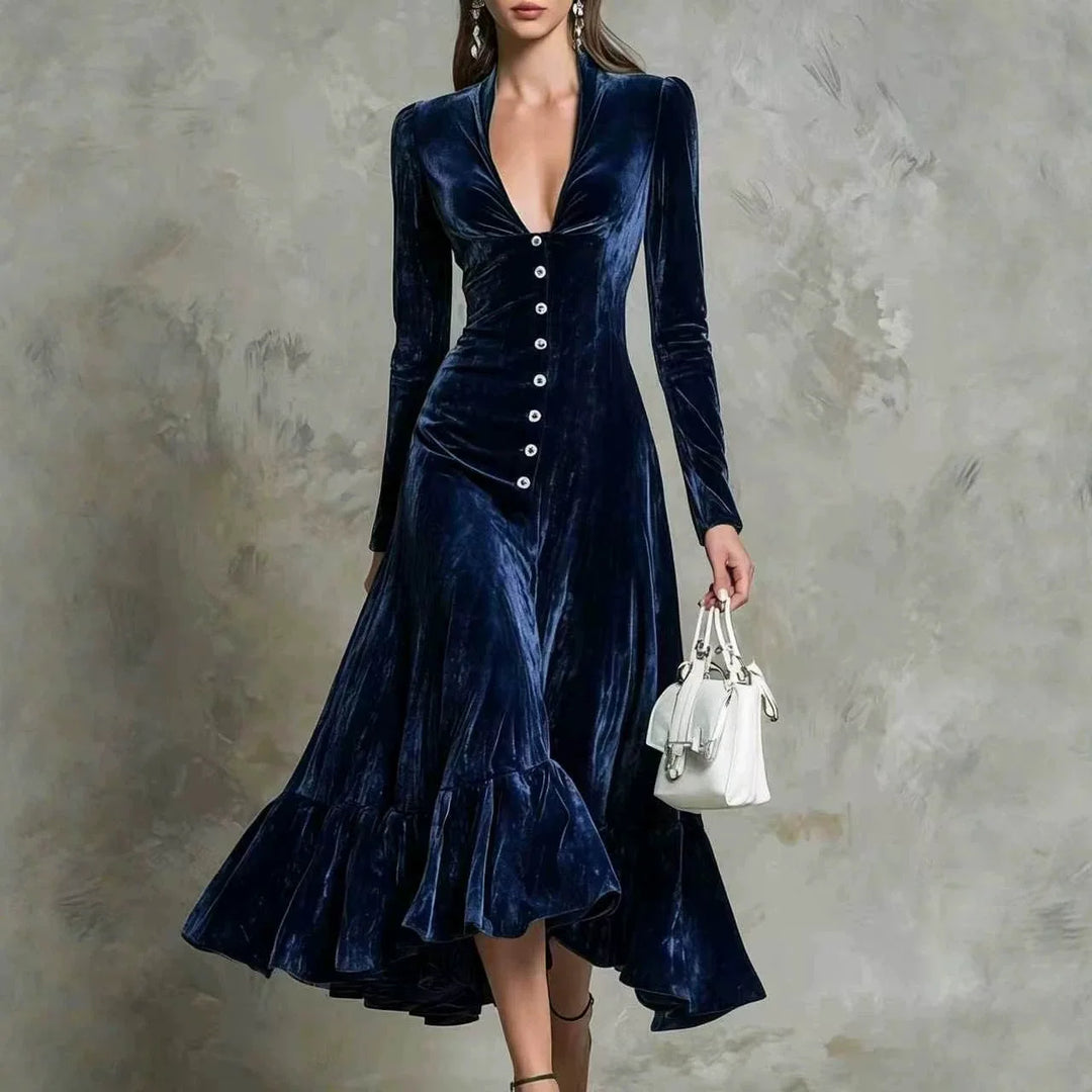 Woman in navy blue velvet midi dress with button front and ruffled hem
