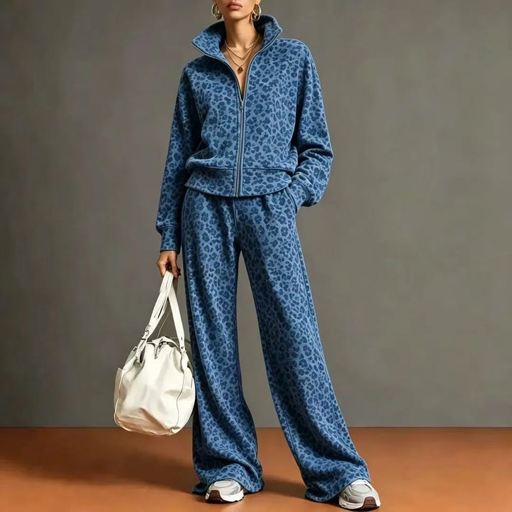 Woman wearing royal blue leopard print zip jacket and wide leg pants set