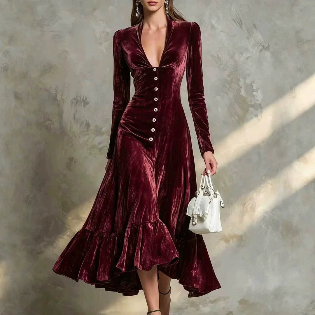 Woman in burgundy velvet midi dress with ruffled high-low hem