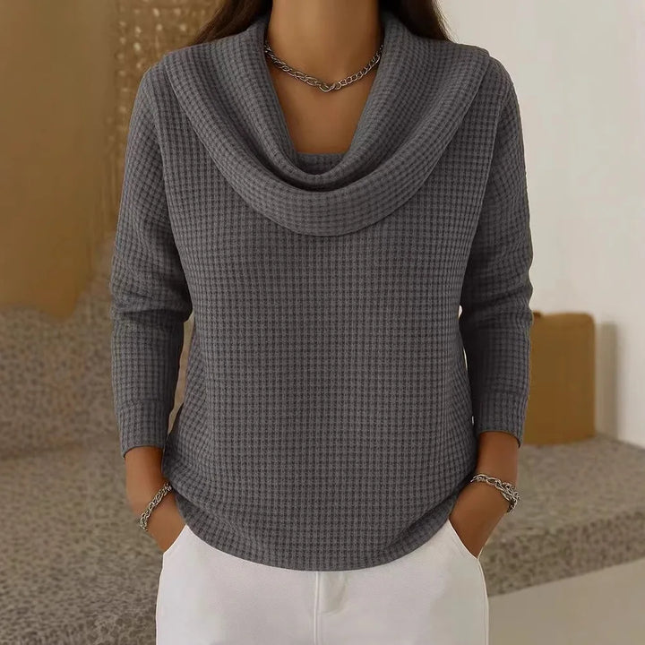 Woman wearing dark gray waffle knit cowl neck top