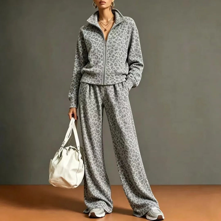 Woman wearing gray leopard print zip jacket and wide leg pants set
