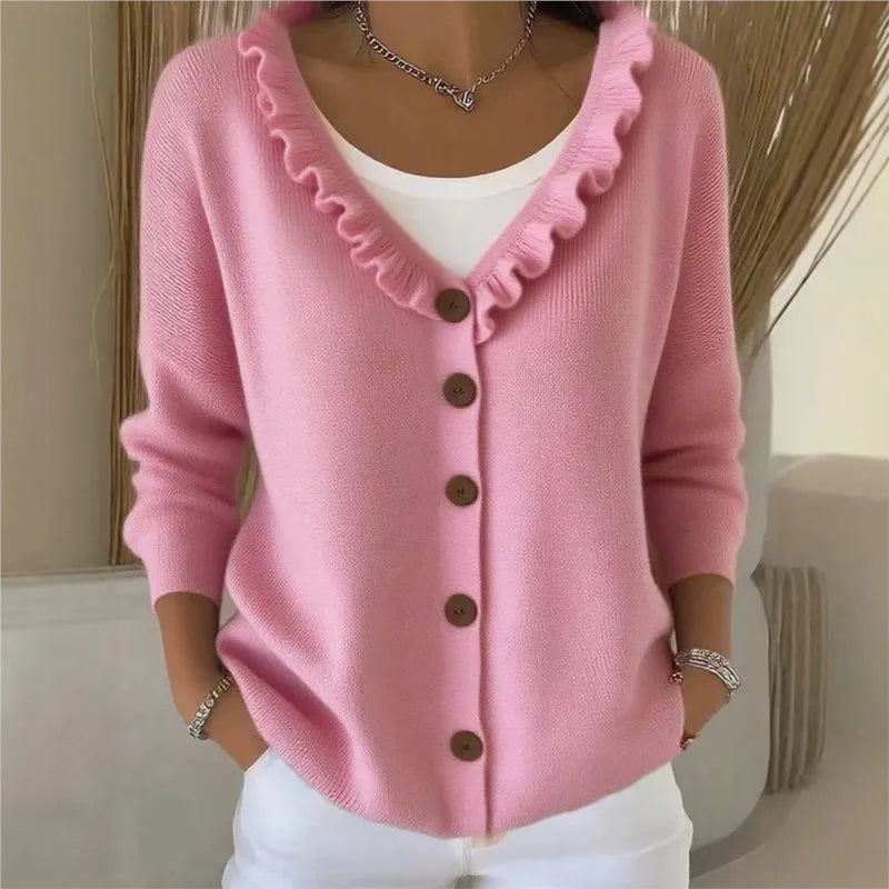Pink ruffle V-neck button front cardigan on model