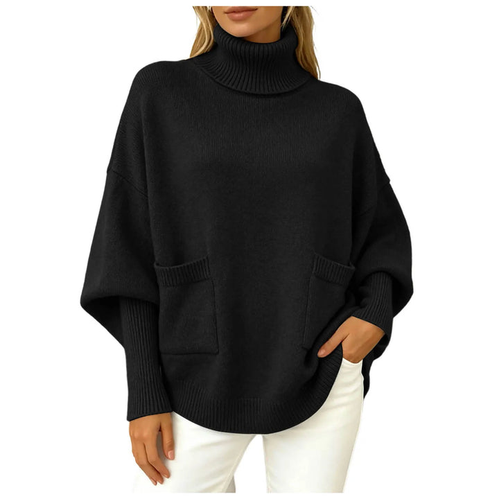 Woman wearing black oversized turtleneck sweater with front pockets