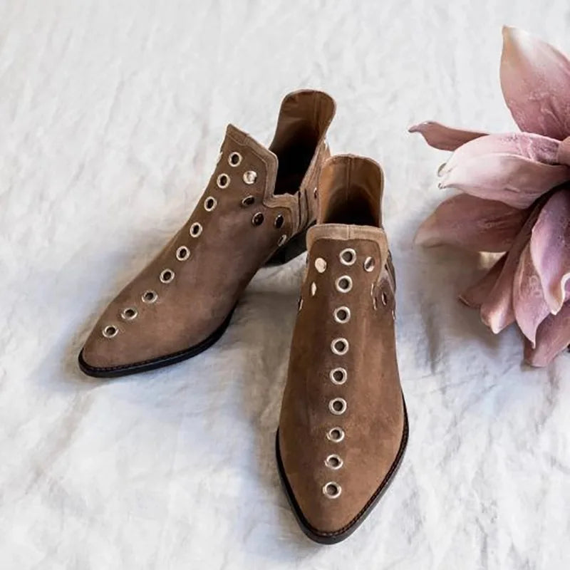 Pair of khaki suede grommet ankle boots with floral accent