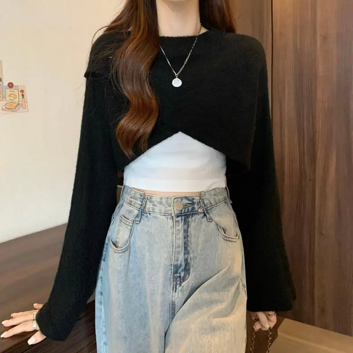 Model wearing black crisscross wrap crop sweater with jeans