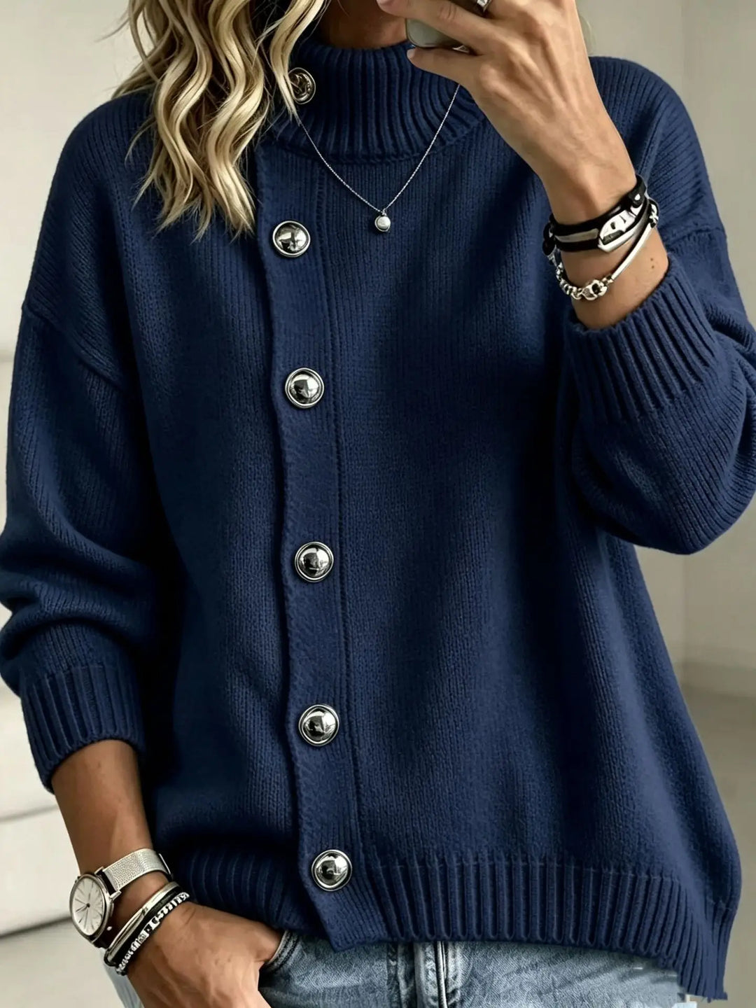 Woman wearing navy blue button front mock turtleneck sweater