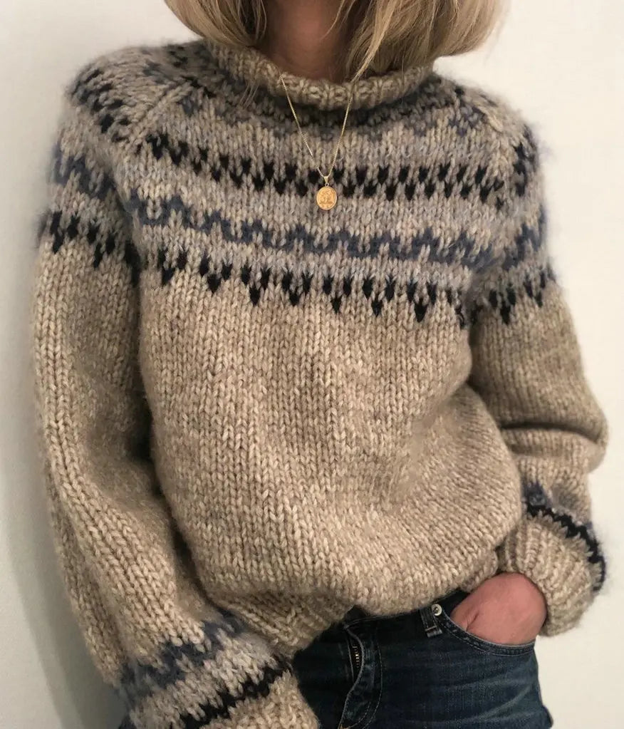 Woman wearing gray turtleneck sweater with pendant necklace