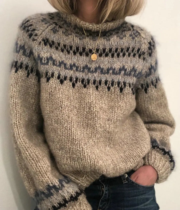 Woman wearing gray turtleneck sweater with pendant necklace