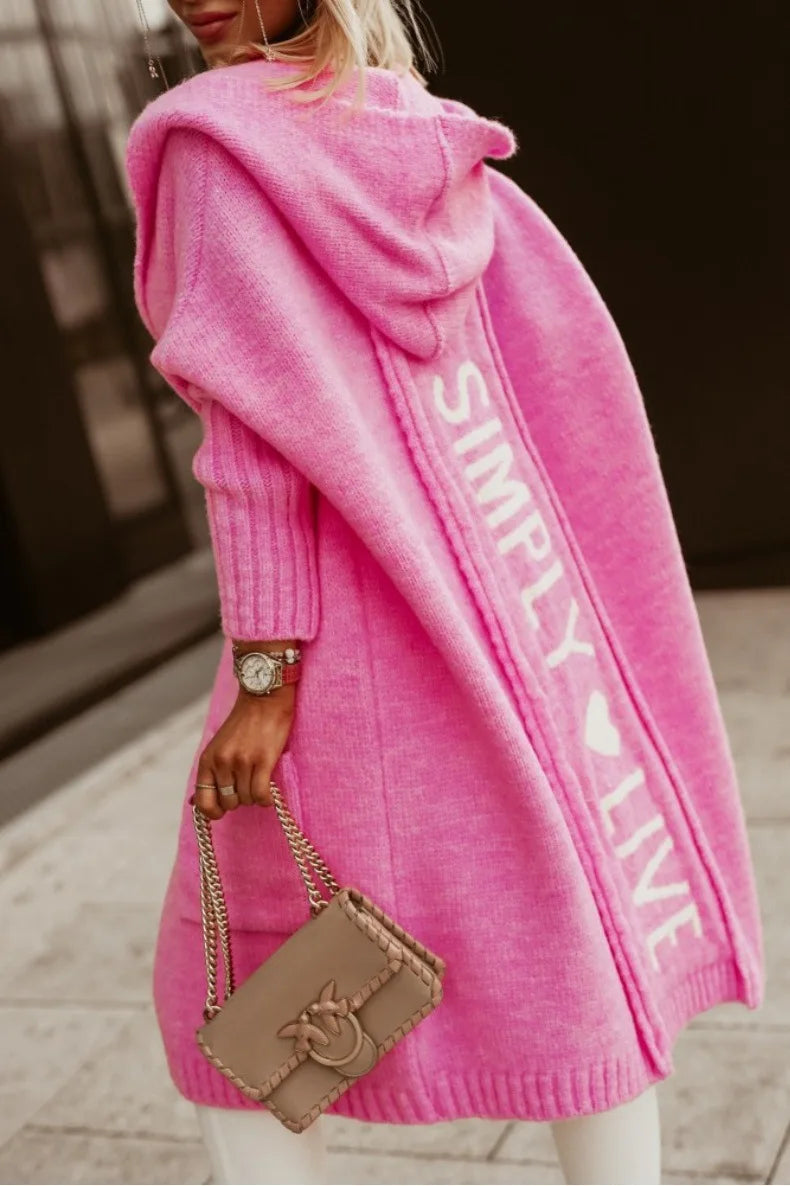 Back view of pink cardigan with knit lettering detail