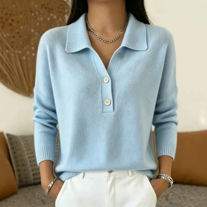 Woman wearing light blue knit polo sweater with button placket
