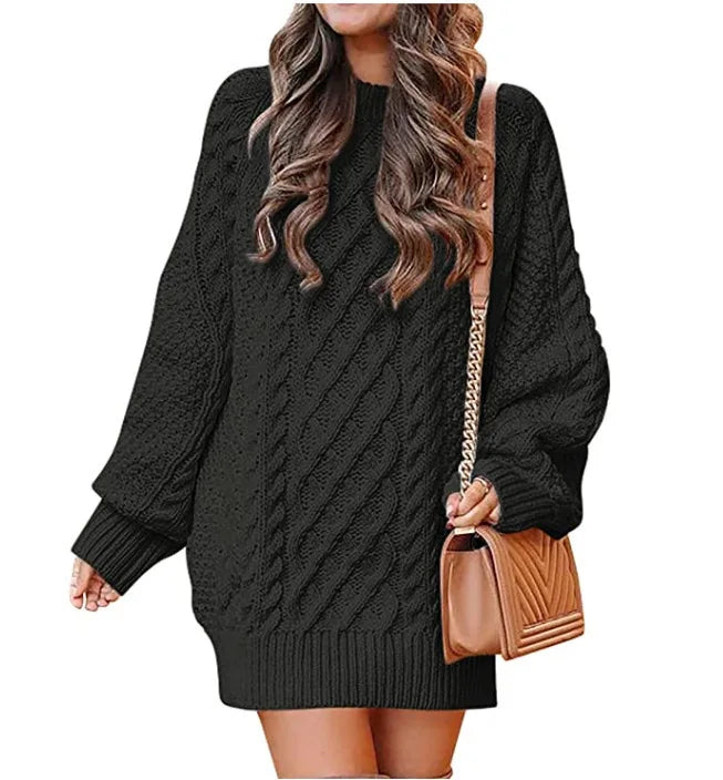 Black cable knit sweater dress on white background