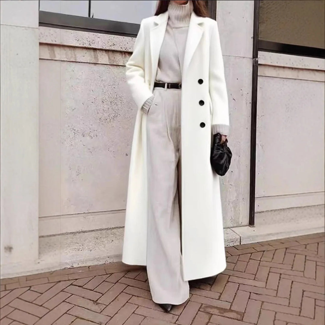 Woman wearing white long trench coat with button front detail