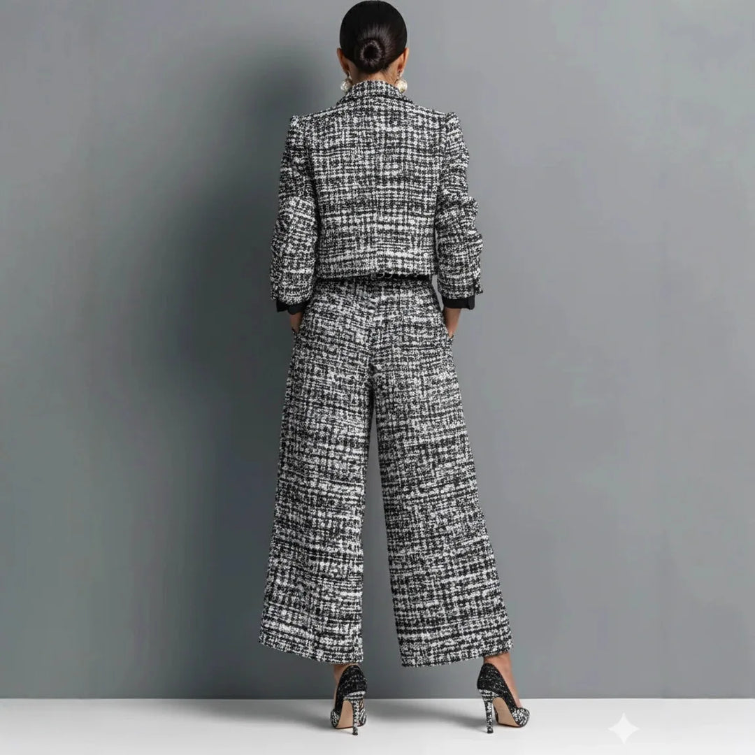 Back view of black and white tweed jacket and wide leg pants set