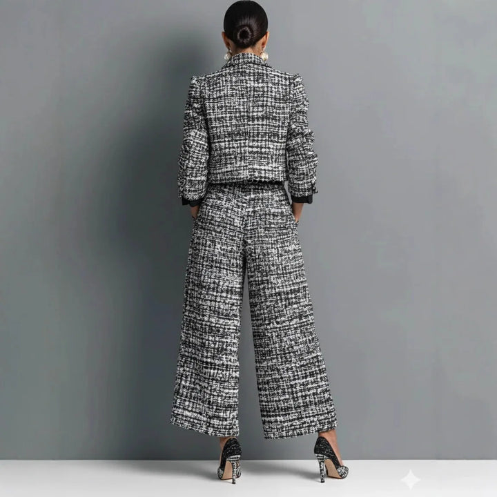 Back view of black and white tweed jacket and wide leg pants set