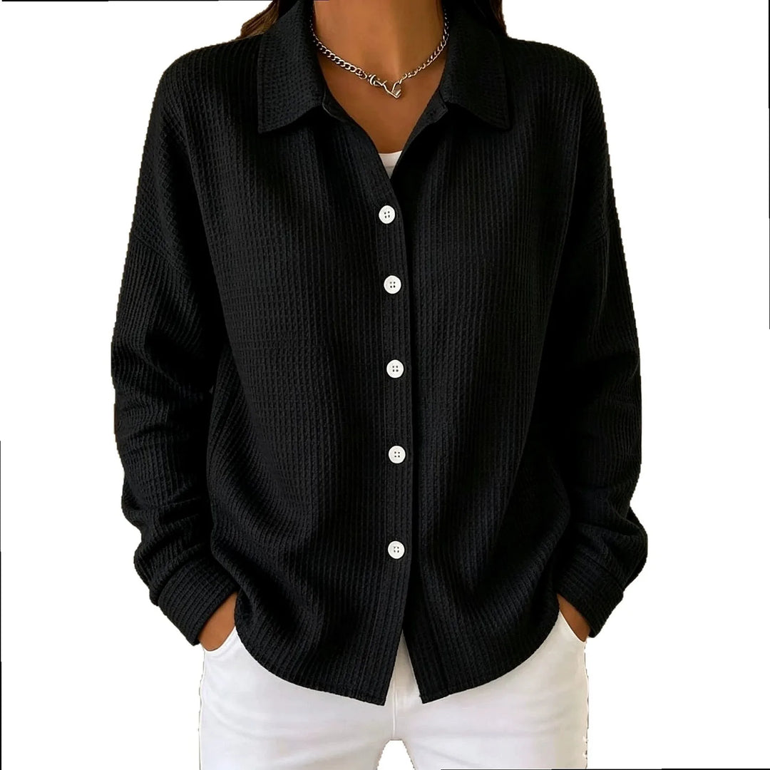 Woman wearing black waffle knit button-front shirt