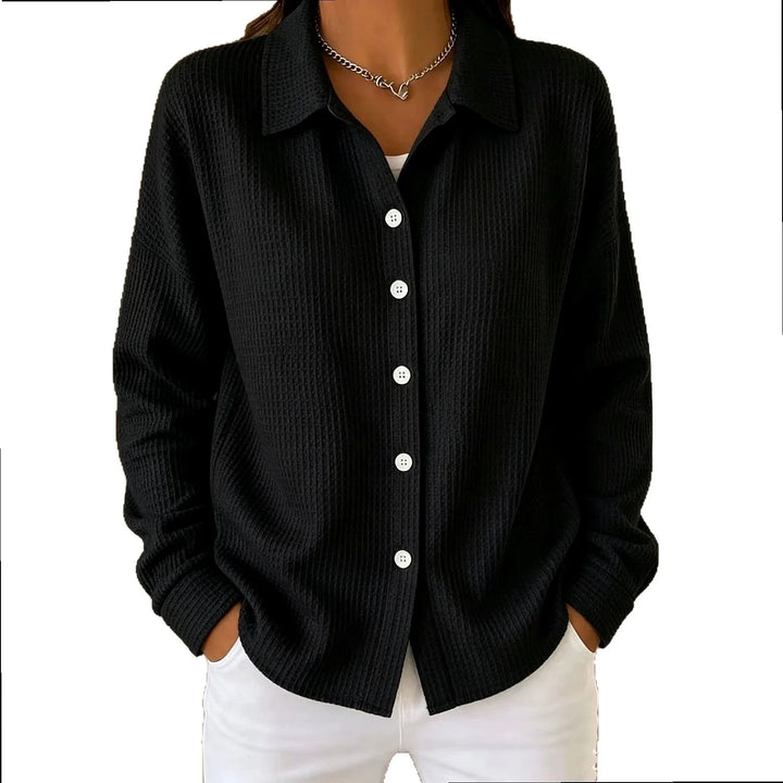 Woman wearing black waffle knit button-front shirt