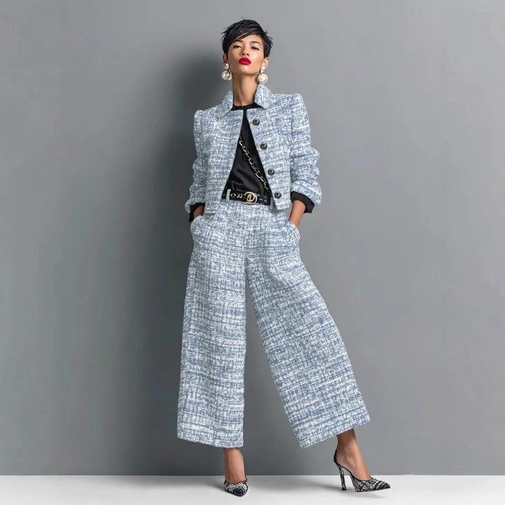 Woman wearing light blue tweed cropped jacket and wide leg pants set