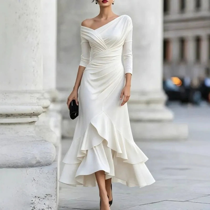 Woman wearing white off-shoulder ruffle hem mermaid dress