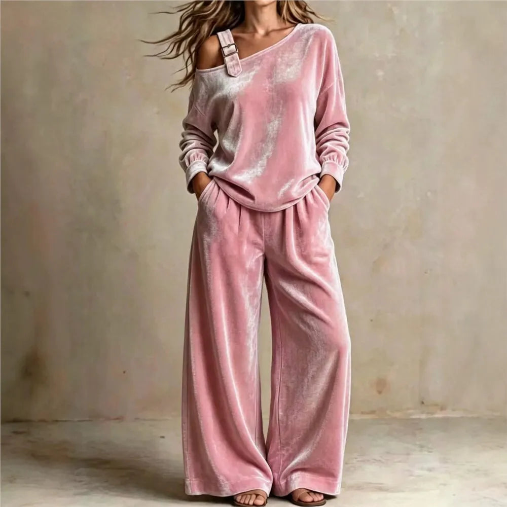 Woman wearing pink velvet off shoulder top and wide leg pants set
