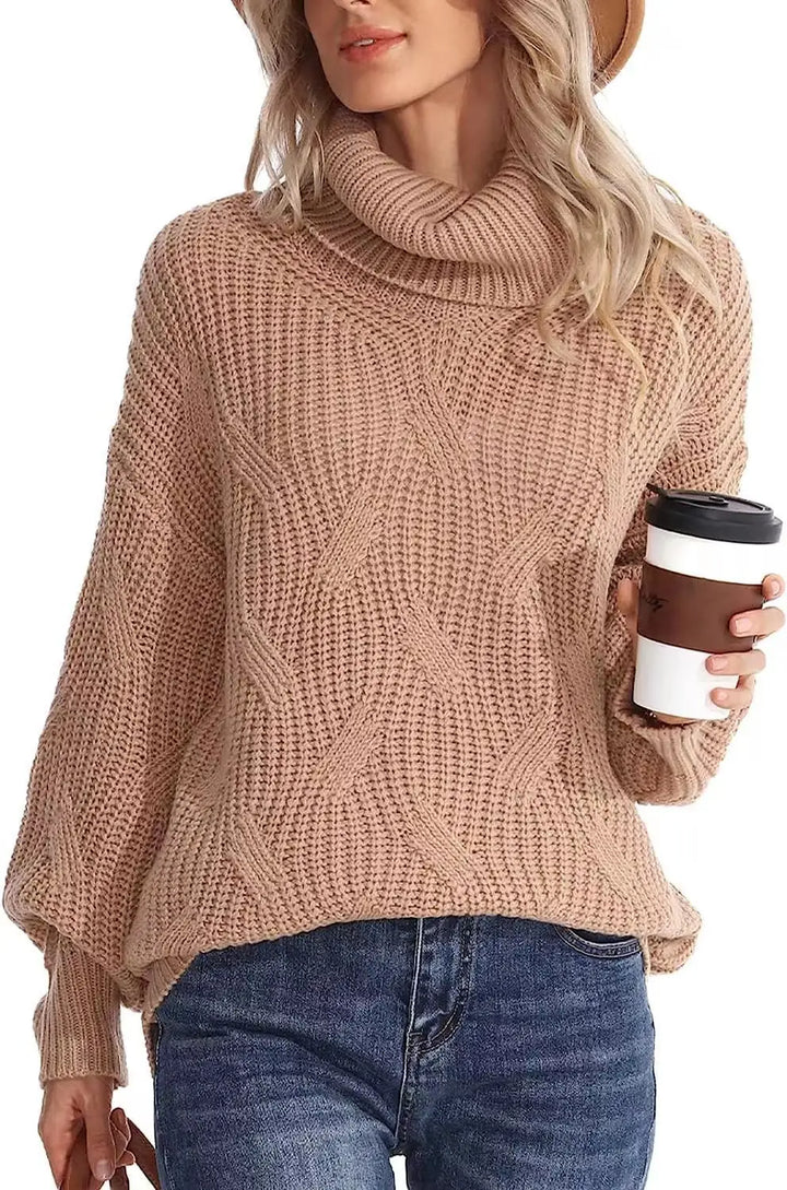 Woman wearing khaki cable knit turtleneck sweater holding coffee