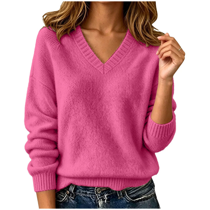 Woman wearing hot pink oversized V-neck knit sweater