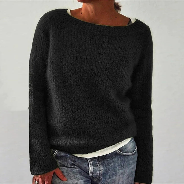 Woman wearing black ribbed knit sweater