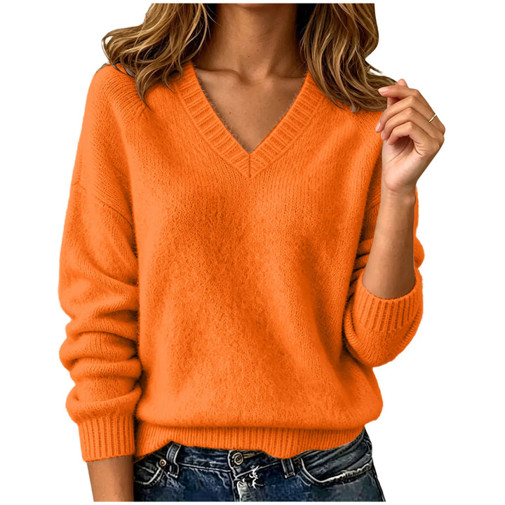 Woman wearing orange oversized V-neck knit sweater
