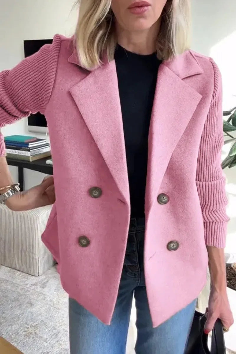 Woman wearing pink double-breasted blazer with ribbed knit sleeves
