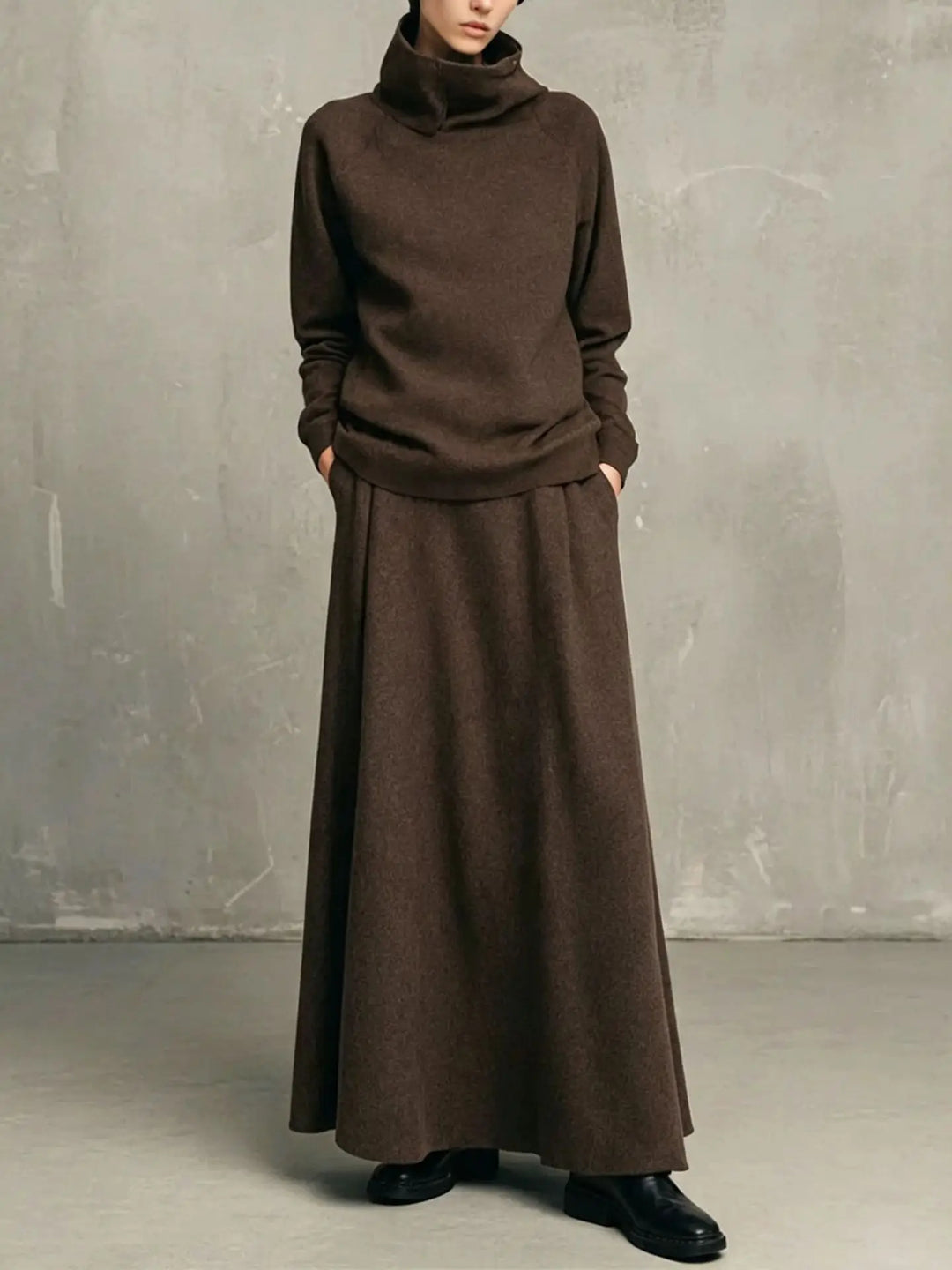 Woman wearing brown coffee funnel neck sweatshirt and matching maxi skirt set